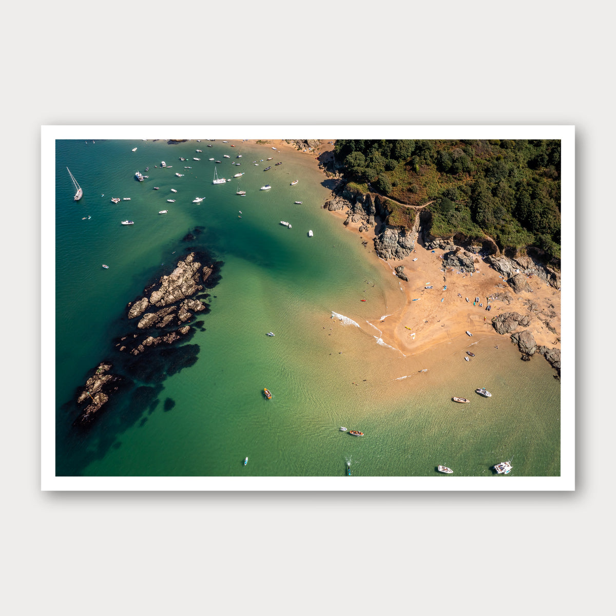 A photographic print of The Turquoise Cove, framed with a white border and shown against a light gray background.