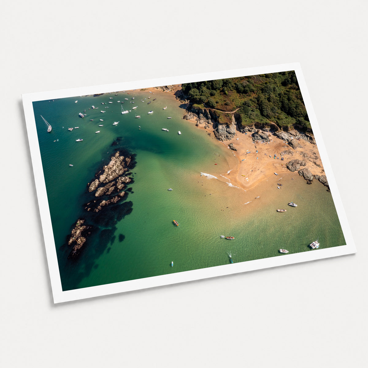 A photographic art print of The Turquoise Cove, displayed at an angle on a light gray background.