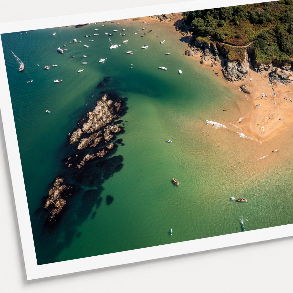 A photographic print of The Turquoise Cove, shown with a white border and angled presentation on a light background.