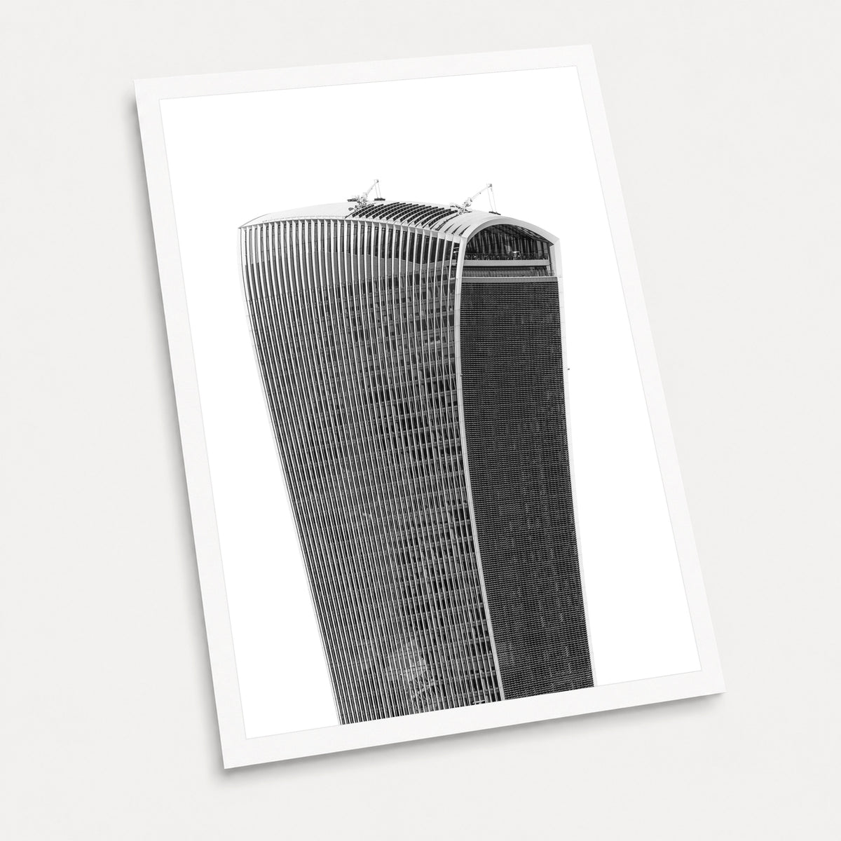 A black and white photographic art print of The Walkie Talkie, displayed at an angle on a light gray background.