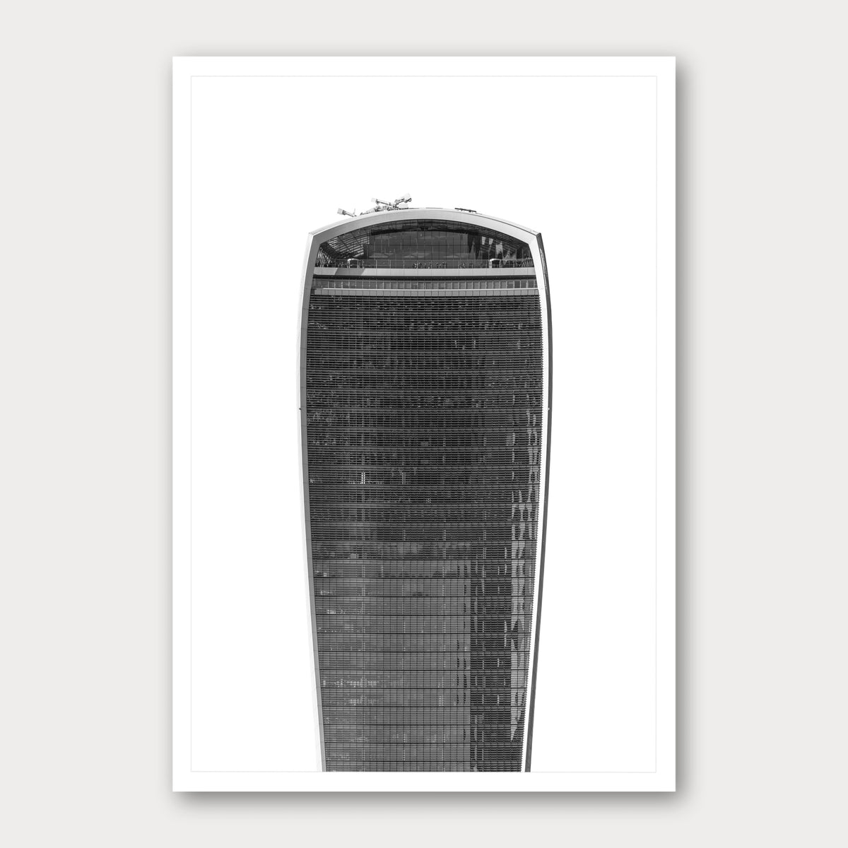 A black and white photographic print of The Walkie Talkie, framed with a white border and shown against a light gray background.