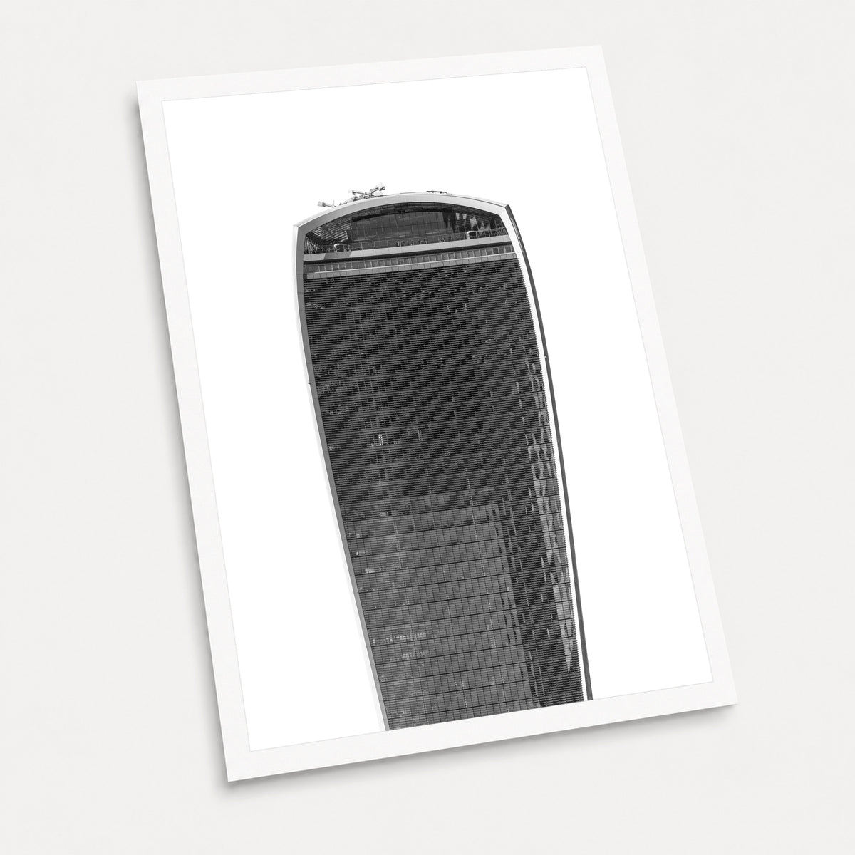 A black and white photographic art print of The Walkie Talkie, displayed at an angle on a light gray background.