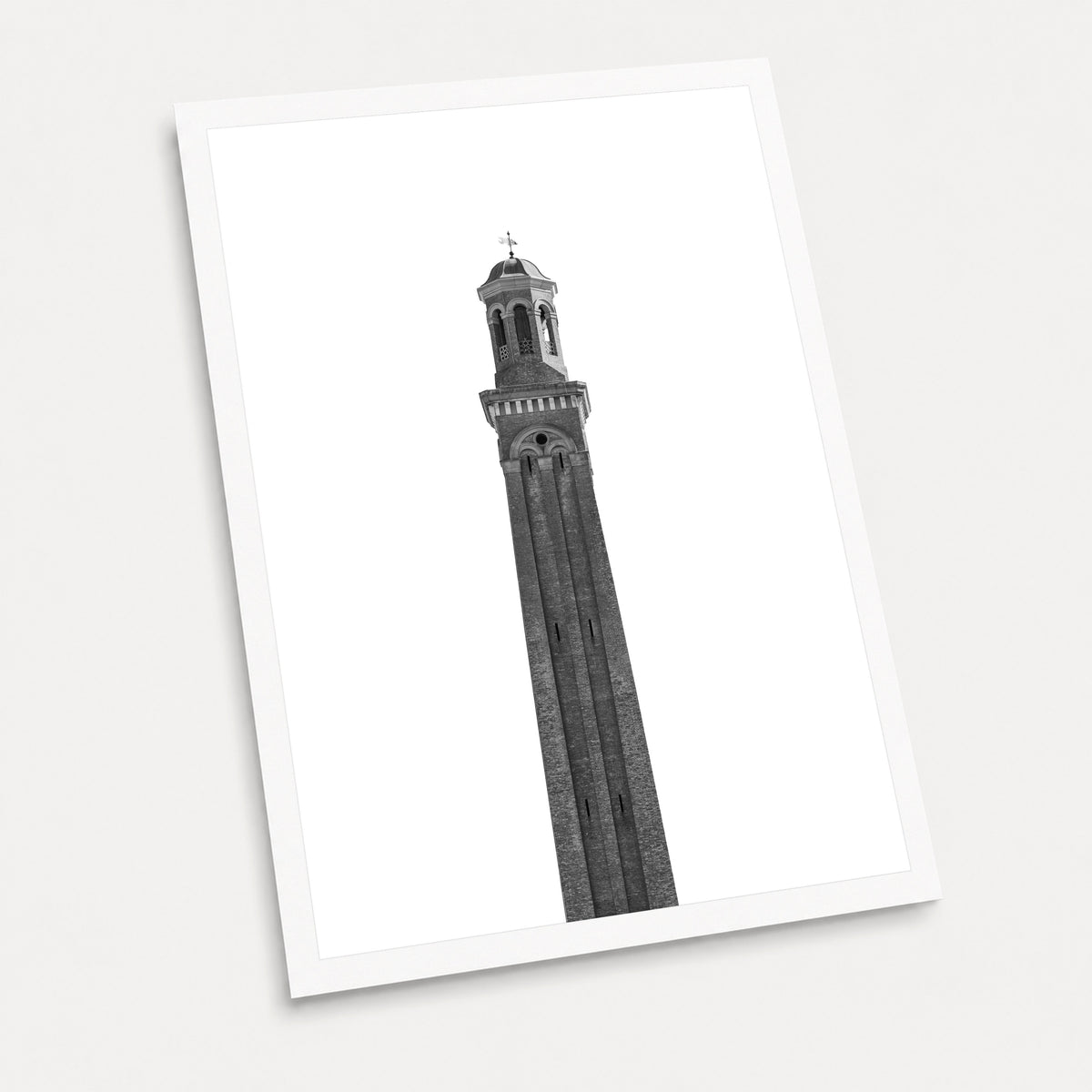 A black and white photographic art print of The Water Tower, displayed at an angle on a light gray background.